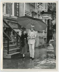 6h281 EASTER PARADE 8.25x10 still '48 Peter Lawford walks Judy Garland home under his umbrella!