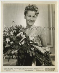 6h723 REBECCA 8.25x10.25 still R46 smiling c/u of Joan Fontaine with bouquet of roses, Hitchcock!