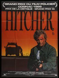 6p738 HITCHER French 1p '86 different image of bloodied Rutger Hauer with machine gun!