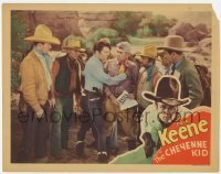 7c174 CHEYENNE KID LC 1933 cowboy Tom Keene surrounded by men with wanted poster!