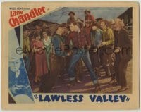 7c471 LAWLESS VALLEY LC 1934 cowboys surround Lane Chandler puching a bad guy in the jaw!