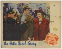 7c591 PALM BEACH STORY LC 1942 great c/u of cop grabbing Joel McCrea as Claudette Colbert laughs!