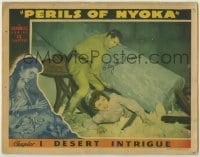 7c613 PERILS OF NYOKA signed ch 1 LC 1942 by Clayton Moore, who saves Aldridge trapped under rubble!