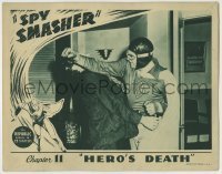 7c818 SPY SMASHER chapter 11 LC 1942 great image of costumed Whiz Comics superhero beating bad guy!