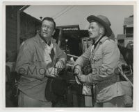 7h770 JOHN WAYNE candid 8.25x10 still 1960 John Wayne & soldier between scenes of North to Alaska!