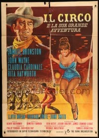 7t437 CIRCUS WORLD Italian 1p 1964 different art of Claudia Cardinale on trapeze & John Wayne!
