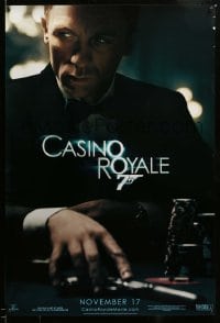 7w380 CASINO ROYALE teaser 1sh 2006 Craig as James Bond sitting at poker table w/gun!
