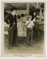 8a180 CIRCUS 7.75x10 still 1928 Tramp Charlie Chaplin with cane staring at boy eating hot dog!