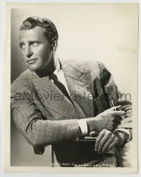 8a734 RALPH BELLAMY 8x10.25 still 1930s sitting in chair holding pipe with a worried look!