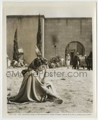 8a821 SPARTACUS candid 8.25x10 still 1960 Jean Simmons on ground smoking at the gates of Rome!