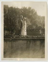 8a956 WHITE SISTER 8x10.25 still 1923 Lillian Gish & Ronald Colman standing on wall in garden!