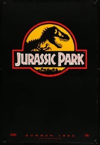 8c494 JURASSIC PARK teaser 1sh 1993 Steven Spielberg, classic logo with T-Rex over yellow background
