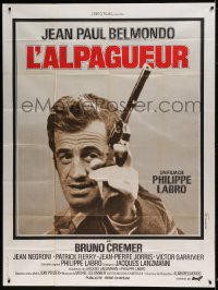 8f685 HUNTER WILL GET YOU French 1p 1976 different close up ot Jean-Paul Belmondo with gun!