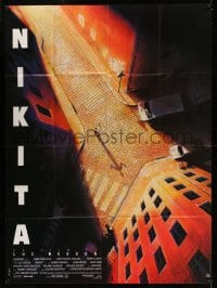 8f726 LA FEMME NIKITA French 1p 1990 Luc Besson, cool overhead art of Anne Parillaud in alley!