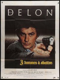 8f936 THREE MEN TO DESTROY French 1p 1980 cool super close image of Alain Delon pointing gun!