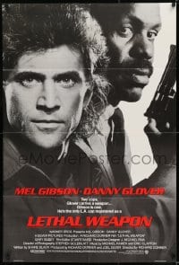 8j487 LETHAL WEAPON advance 1sh 1987 great close image of cop partners Mel Gibson & Danny Glover!