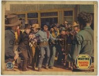 8k824 PARADISE CANYON LC R1939 great image of young John Wayne holding back crowd from bad guys!