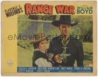8k848 RANGE WAR LC 1939 William Boyd as Hopalong Cassidy c/u with gun drawn protecting Betty Moran!