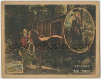8k918 TERROR LC 1926 great image of cowboy Art Acord gearing up his horse for adventure!