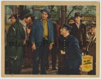 8z457 I'LL GIVE A MILLION LC 1938 Warner Baxter & cop stare at tramp John Carradine!