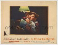 8z862 STAR IS BORN LC #2 1954 great close up of sad Judy Garland hugging James Mason, classic!