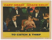 8z909 TO CATCH A THIEF LC #8 1955 Cary Grant behind woman at casino baccarat table, Alfred Hitchcock