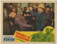 8z920 TROUBLE IN SUNDOWN LC 1939 c/u of tough cowboy George O'Brien knocking out his opponent!