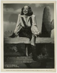 9s283 DOROTHY LAMOUR 8x10.25 still 1943 smiling portrait in western outfit standing by cactus!