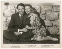 9s485 IT'S A WONDERFUL LIFE 8x10.25 still 1946 happy James Stewart & Donna Reed sitting on ground!
