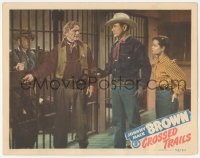 9z183 CROSSED TRAILS LC #5 1948 Johnny Mack Brown points gun at sheriff Osborne unlocking the jail!