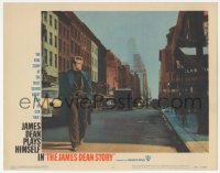 9z421 JAMES DEAN STORY LC #3 1957 walking down Manhattan street smoking in cool overcoat!