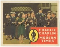 9z564 MODERN TIMES LC R1960s great image of Charlie Chaplin with Paulette Goddard, cop & crowd!