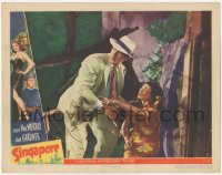 9z762 SINGAPORE LC #2 1947 injured Maylia shows dapper Fred MacMurray where the bad guys went!