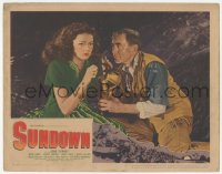 9z829 SUNDOWN LC 1941 close up of Harry Carey giving gas mask to scared Gene Tierney!