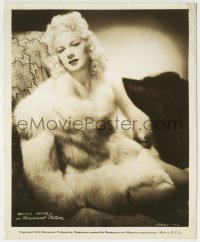 1h140 BETTY HUTTON 8.25x10 still 1943 lounging on chair in full fur coat & come hither look!