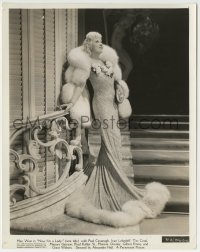 1h361 GOIN' TO TOWN 8.25x10 still 1935 Mae West in modest sheath of yellow crepe & white fox!