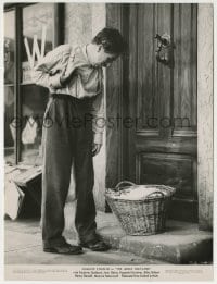1h382 GREAT DICTATOR 7.5x9.5 still 1940 Charlie Chaplin looking down into basket sitting by door!