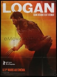 1p733 LOGAN teaser French 1p 2017 Jackman in the title role as Wolverine holding Dafne Keen!