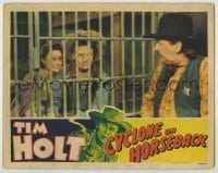 1r455 CYCLONE ON HORSEBACK LC 1941 Tim Holt & Marjorie Reynolds behind bars smiling at sheriff!