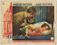 1r465 DESIRE LC 1936 John Halliday tries to rouse sleeping jewel thief Marlene Dietrich in bed!