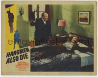 1r552 HANGMEN ALSO DIE LC 1943 guy in tuxedo laughs at Dennis O'Keefe tied to bed, Fritz Lang!