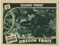 1r709 OREGON TRAIL chapter 13 LC 1939 c/u of Johnny Mack Brown helping injured old guy under wagon!