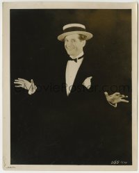 2a534 INNOCENTS OF PARIS 8.25x10.25 still 1929 Maurice Chevalier in tuxedo over black background!