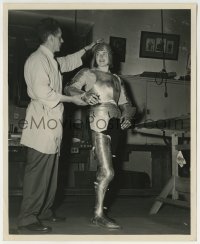 2a565 JOAN OF ARC candid 8.25x10 still 1948 costume man helps Ingrid Bergman fit into her armor!