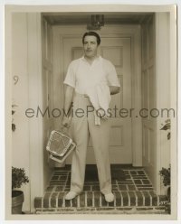 2a566 JOHN BOLES 8x10 still 1934 by his home, he keeps fit by playing tennis & bicycling!