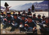 2d899 WORLD FOOD PROGRAMME 19x27 special poster 2000 children being fed in Bhutan