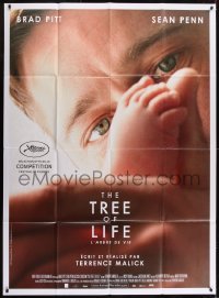 2p981 TREE OF LIFE French 1p 2011 super close up of Brad Pitt looking at baby's feet!