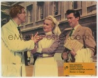 3c421 DOCTOR AT LARGE English LC 1957 c/u of Dr. Dirk Bogarde & pretty Shirley Eaton with doctor!