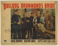3c347 BULLDOG DRUMMOND'S BRIDE LC 1939 crowd stares at policeman holding disarmed bomb!