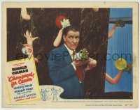 3c366 CHAMPAGNE FOR CAESAR LC #8 1950 c/u of Ronald Colman by wall of arms holding flowers!